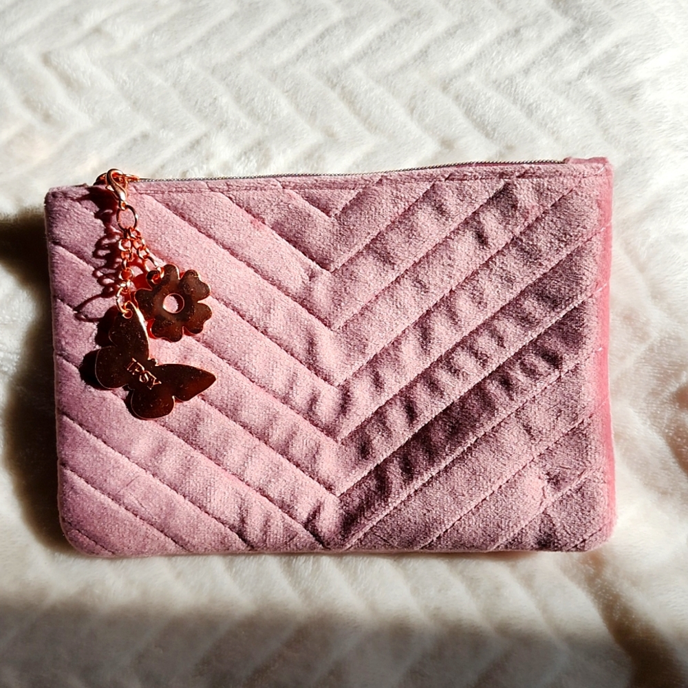 Pink bag with butterfly charms